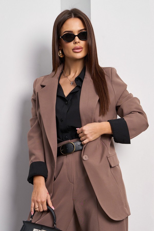 Tailored taupe blazer styled with a black shirt