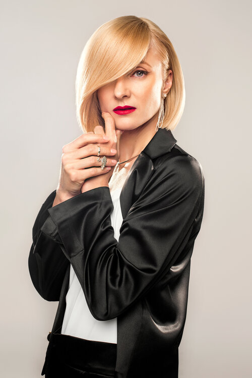 Editorial styling with a taupe blazer and dried flowers